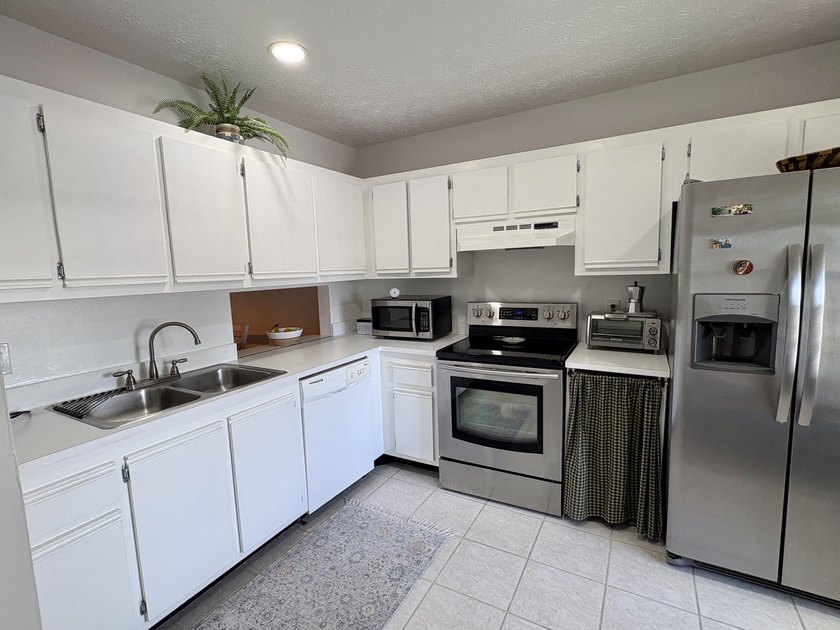 Beautifully updated 2-bedroom, 2-bath second-floor condo located - photo 3