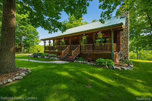 Welcome to this meticulously maintained 2,400 sq. ft. log home - photo 2