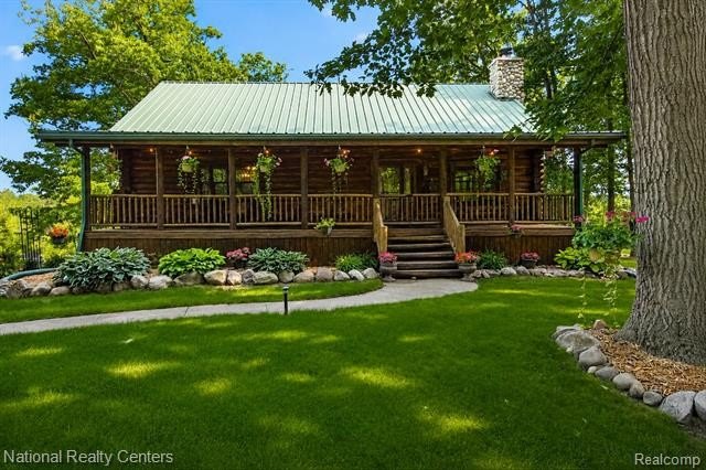 Welcome to this meticulously maintained 2,400 sq. ft. log home - photo 3