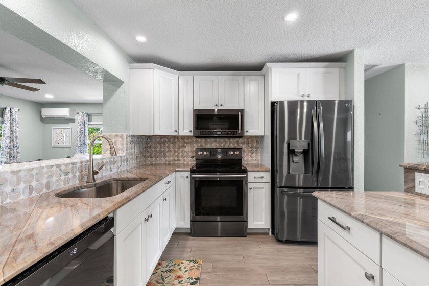 Completely transformed and move-in ready with NO HOA! This - photo 7