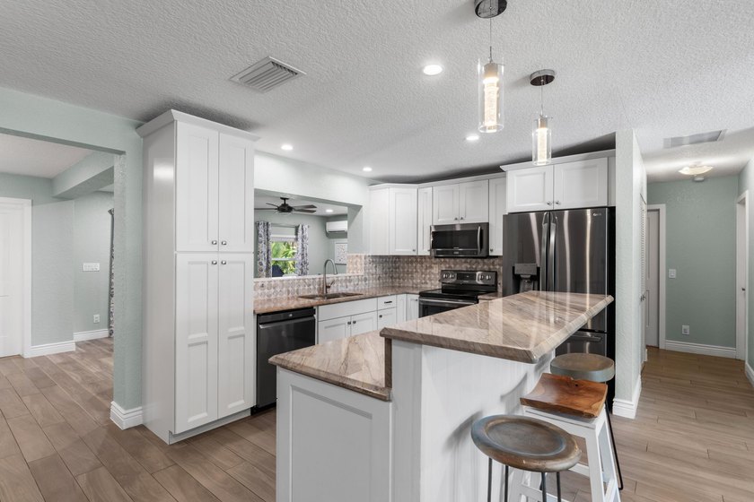 Completely transformed and move-in ready with NO HOA! This - photo 8