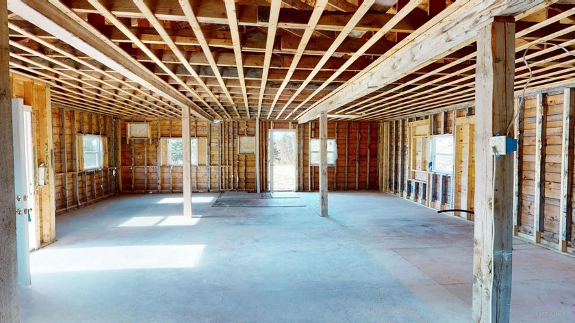 One-floor ranch interior brought down to the studs and awaits a - photo 21