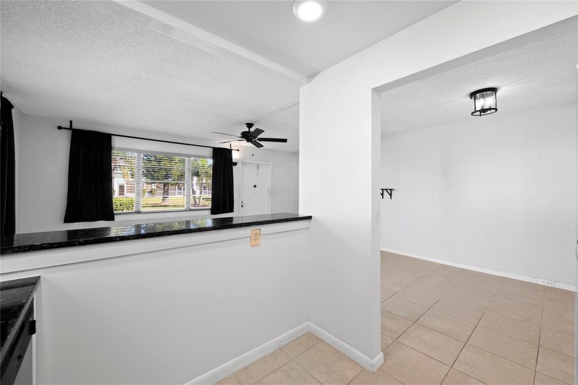 Spacious 1-bedroom, 1.5-bathroom condo conveniently located on - photo 4