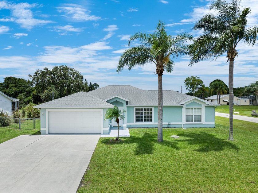 Welcome to 2297 SE Marsh Ave, a 3-bedroom, 2-bath home in a - photo 2