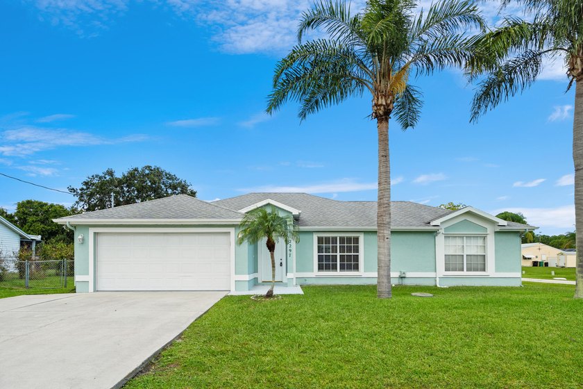 Welcome to 2297 SE Marsh Ave, a 3-bedroom, 2-bath home in a - photo 3