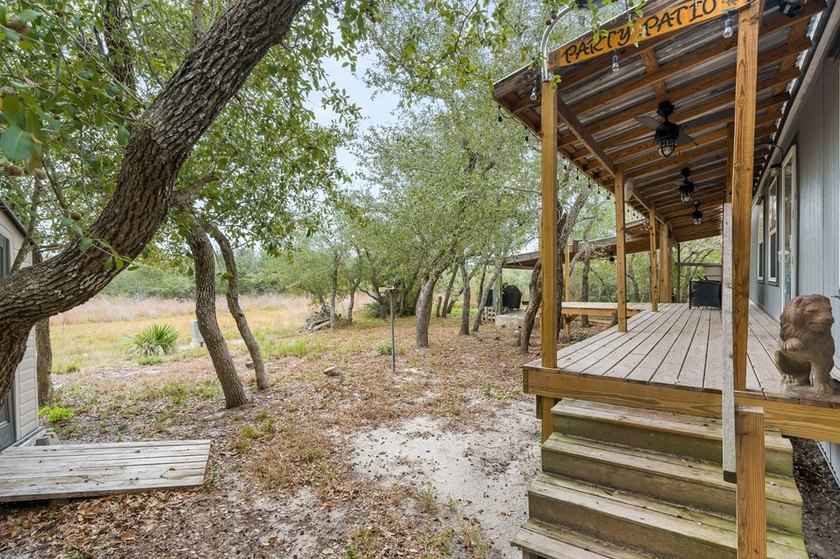 Nestled on wooded land along a quiet road, this newer - photo 2