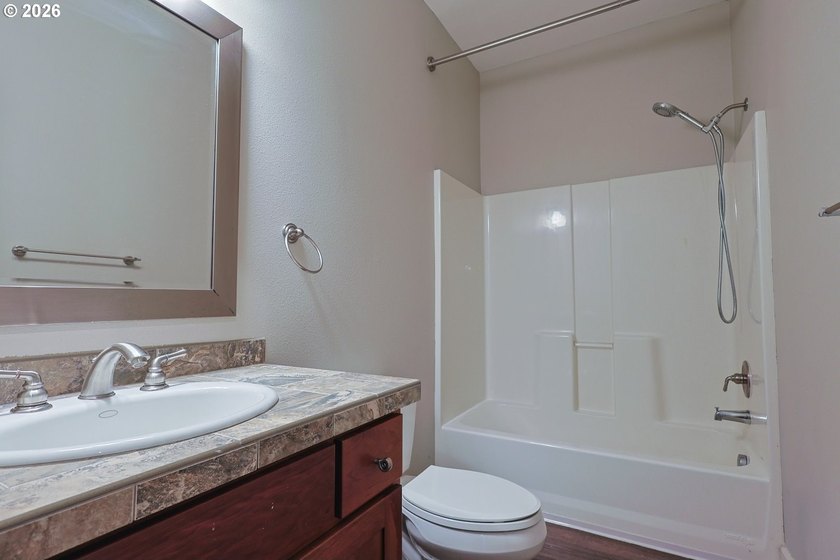 Thoughtfully designed with spacious rooms and an open, vaulted - photo 21