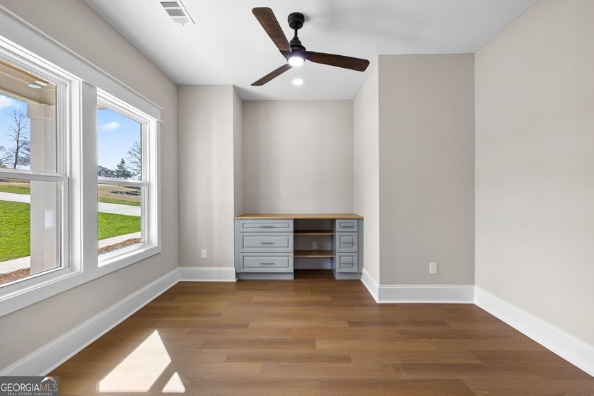 Stunning new construction overlooking a private lake, offering a - photo 11