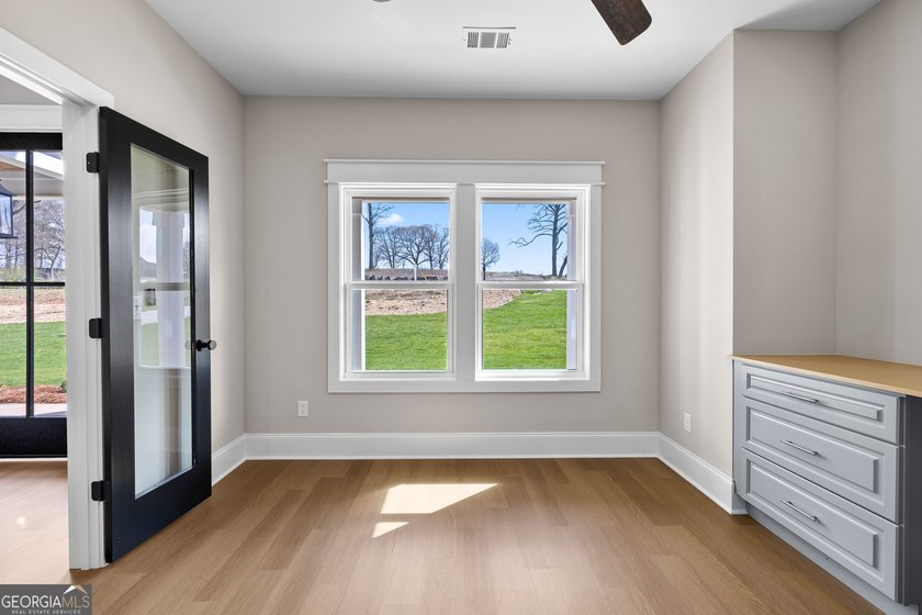 Stunning new construction overlooking a private lake, offering a - photo 12
