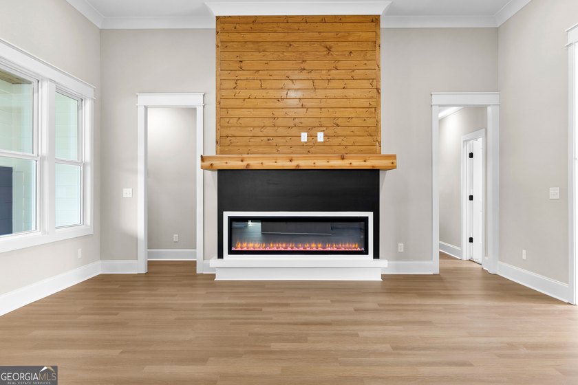Stunning new construction overlooking a private lake, offering a - photo 15