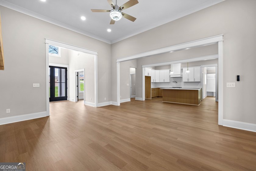 Stunning new construction overlooking a private lake, offering a - photo 17