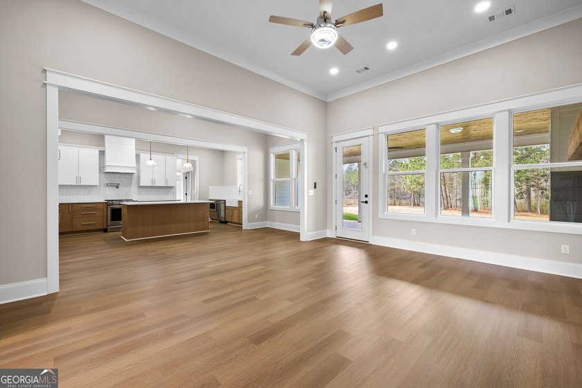 Stunning new construction overlooking a private lake, offering a - photo 18