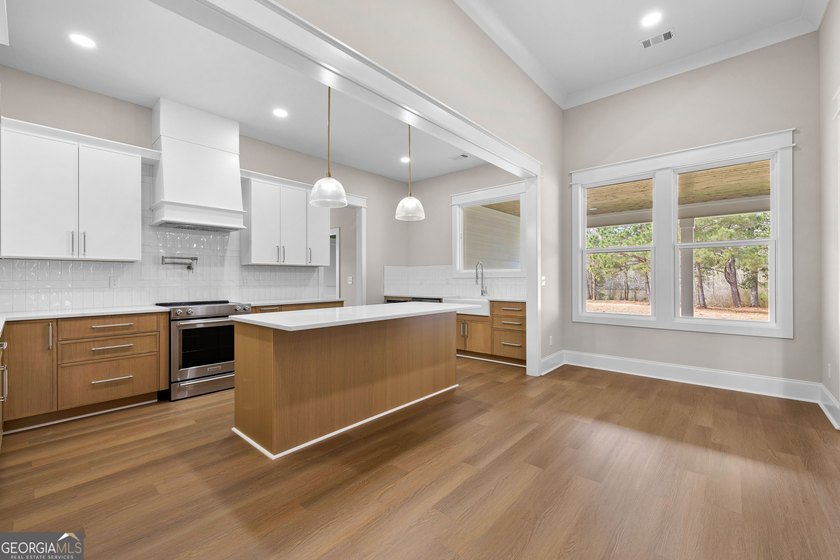 Stunning new construction overlooking a private lake, offering a - photo 20