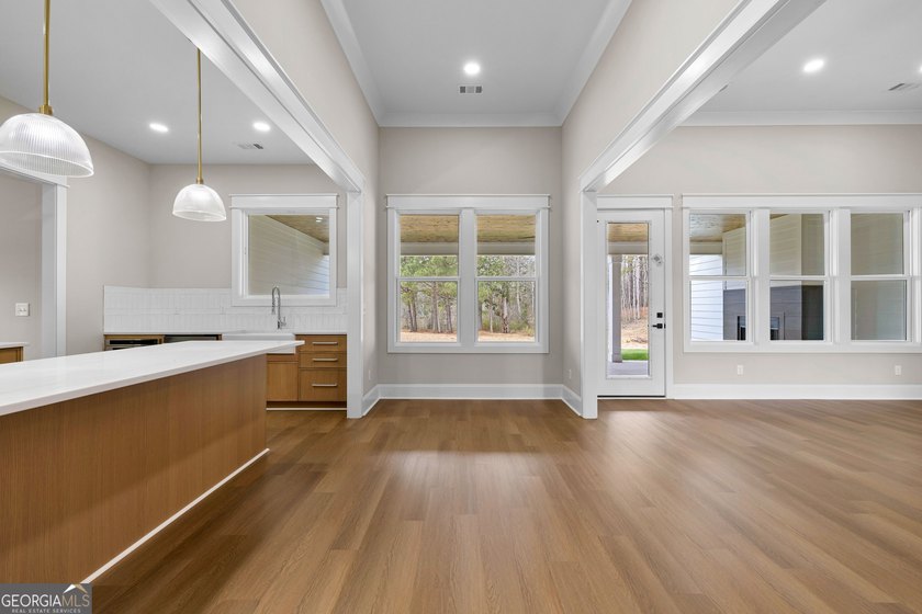 Stunning new construction overlooking a private lake, offering a - photo 21