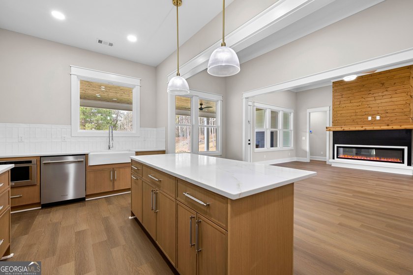 Stunning new construction overlooking a private lake, offering a - photo 24