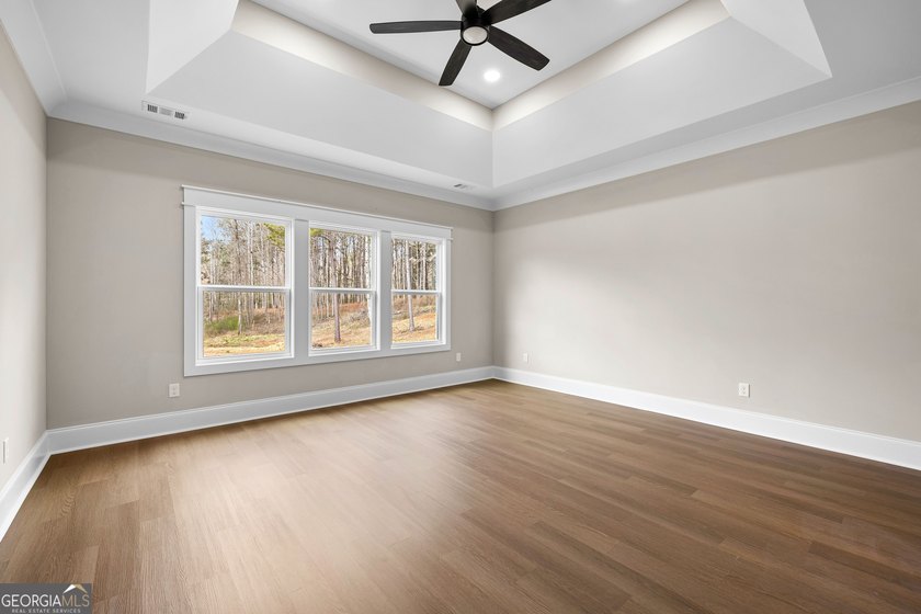 Stunning new construction overlooking a private lake, offering a - photo 30