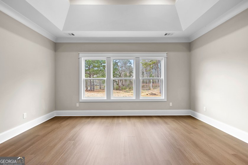 Stunning new construction overlooking a private lake, offering a - photo 31