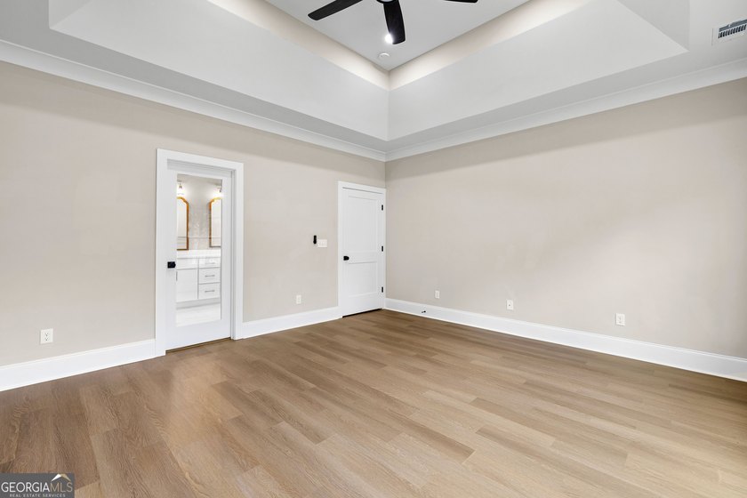 Stunning new construction overlooking a private lake, offering a - photo 32