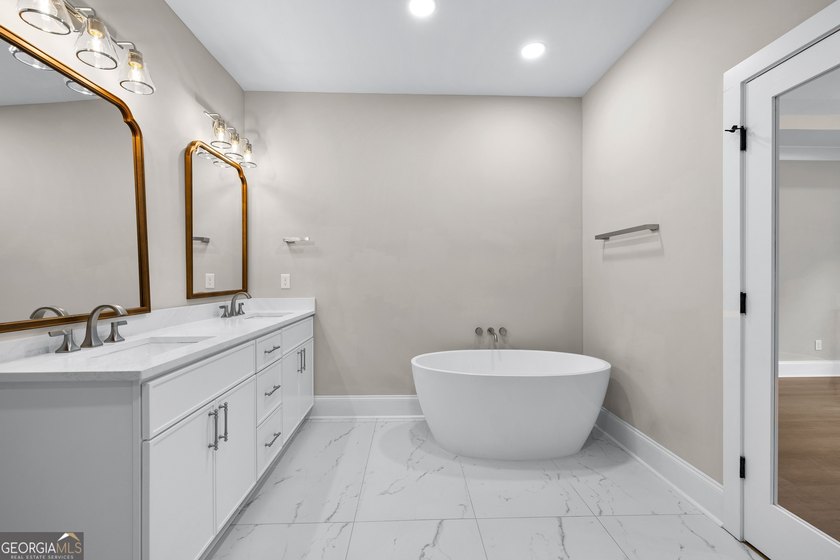 Stunning new construction overlooking a private lake, offering a - photo 34