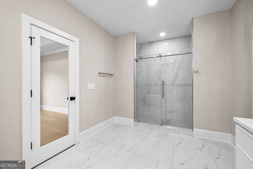 Stunning new construction overlooking a private lake, offering a - photo 35