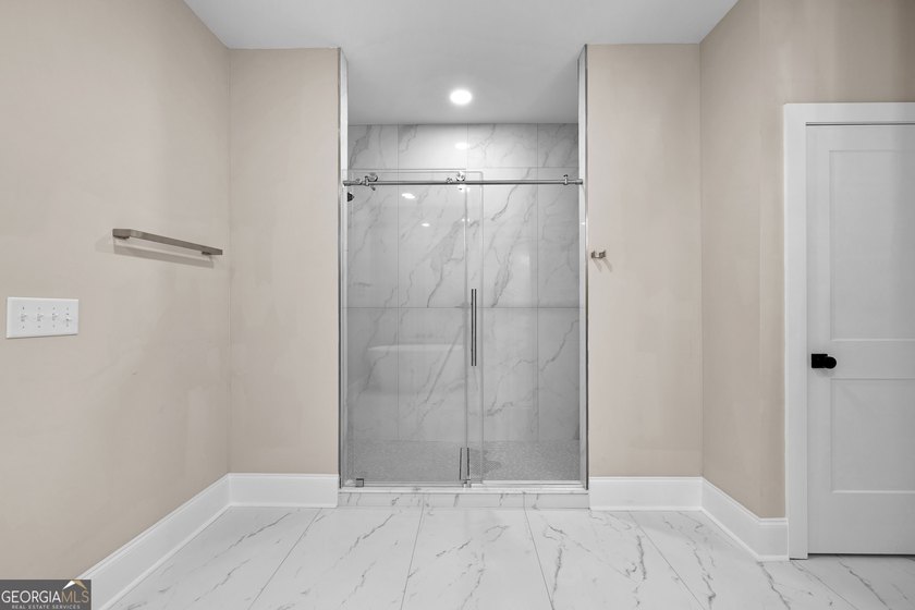 Stunning new construction overlooking a private lake, offering a - photo 36