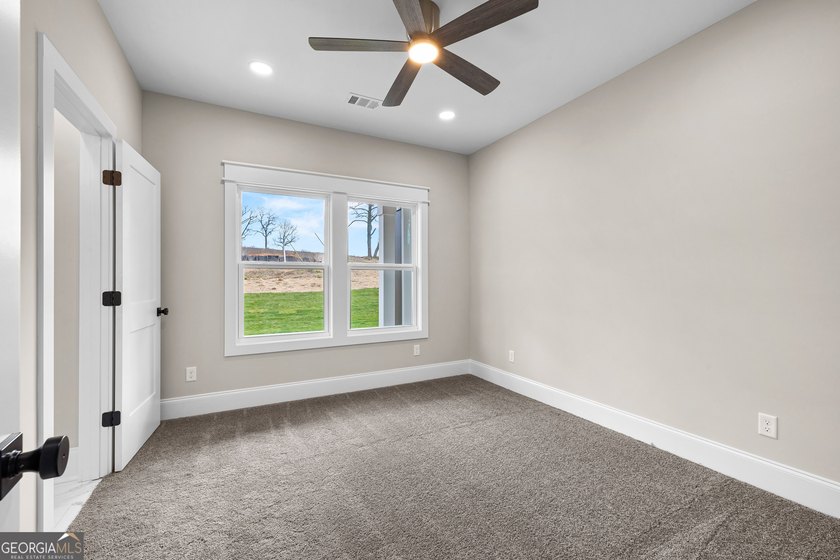 Stunning new construction overlooking a private lake, offering a - photo 39