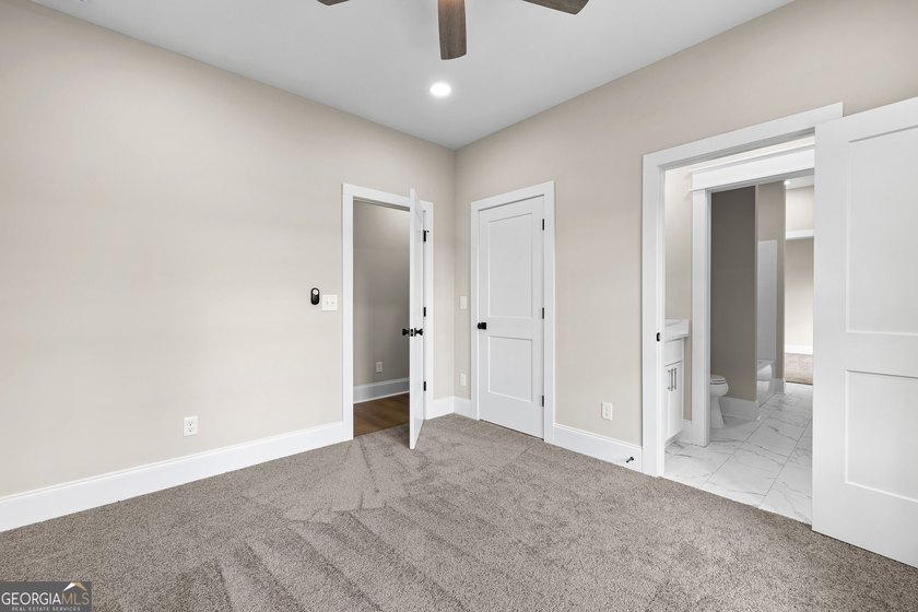 Stunning new construction overlooking a private lake, offering a - photo 40