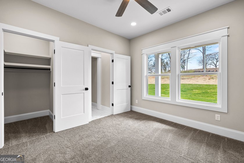 Stunning new construction overlooking a private lake, offering a - photo 41