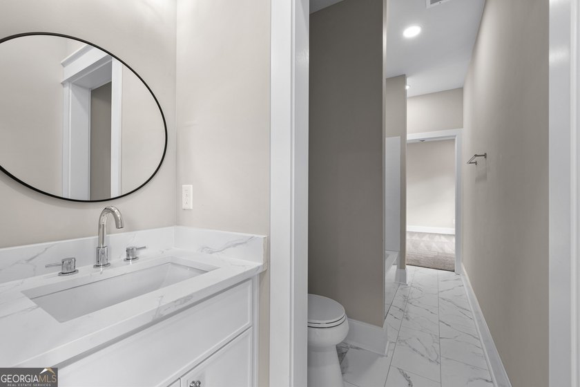 Stunning new construction overlooking a private lake, offering a - photo 42