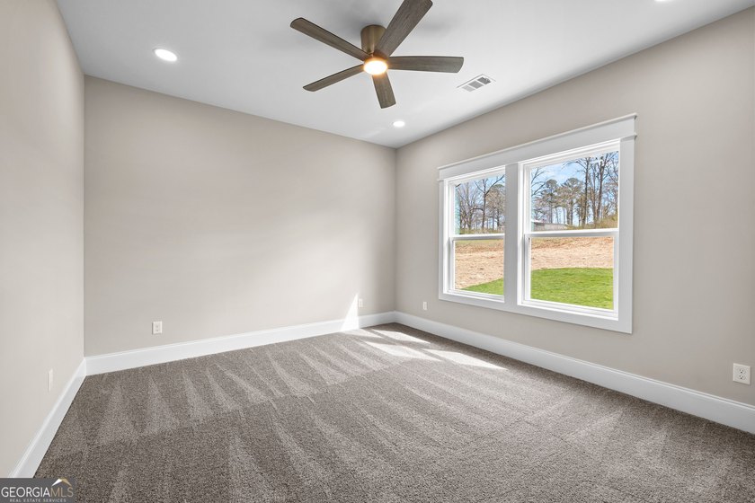 Stunning new construction overlooking a private lake, offering a - photo 44