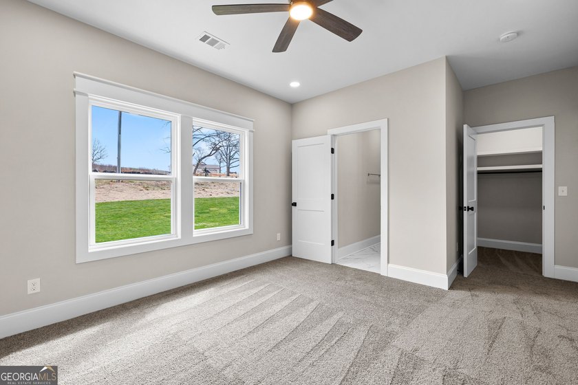 Stunning new construction overlooking a private lake, offering a - photo 45