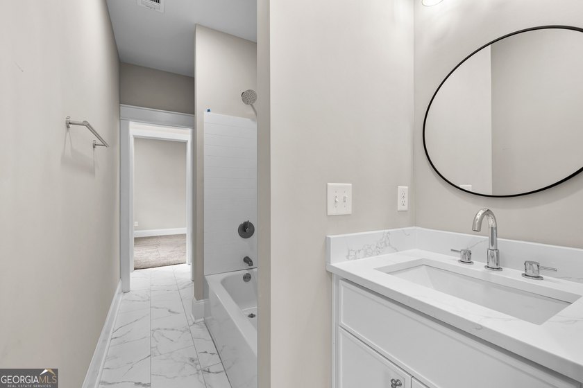 Stunning new construction overlooking a private lake, offering a - photo 46