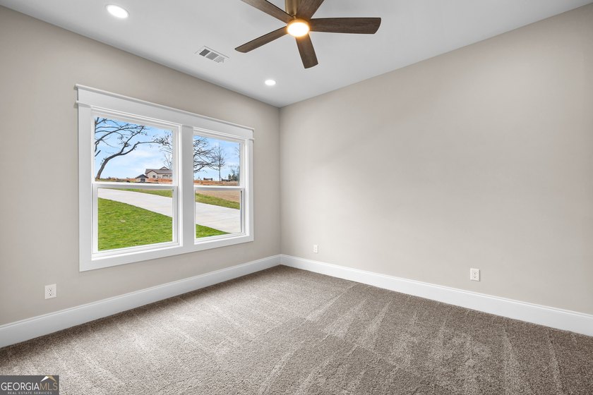Stunning new construction overlooking a private lake, offering a - photo 49