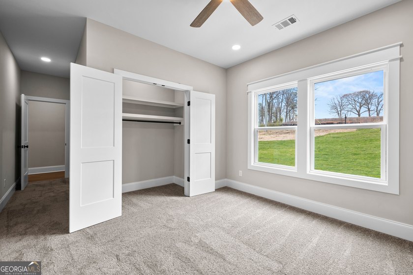 Stunning new construction overlooking a private lake, offering a - photo 50