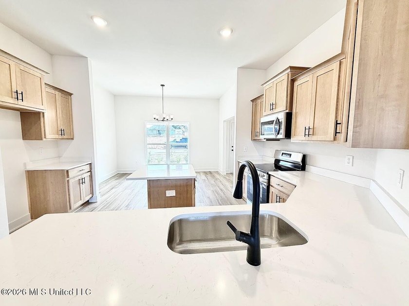 This beautifully designed 4 bedroom, 2 bath home blends modern - photo 3