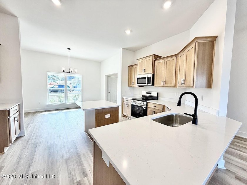 This beautifully designed 4 bedroom, 2 bath home blends modern - photo 4