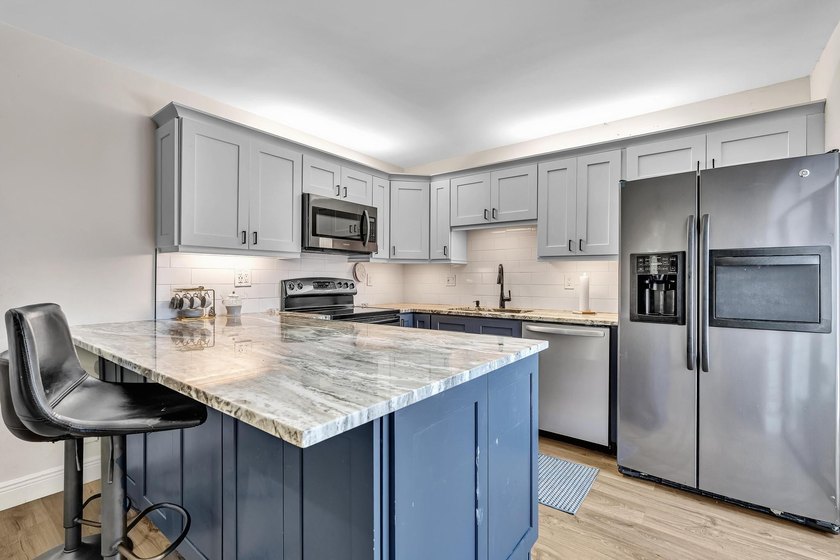 This spacious, light-filled residence features a beautifully - photo 2