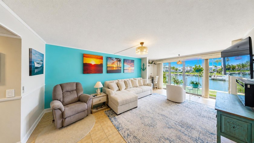 Waterfront living awaits in this beautifully maintained - photo 7