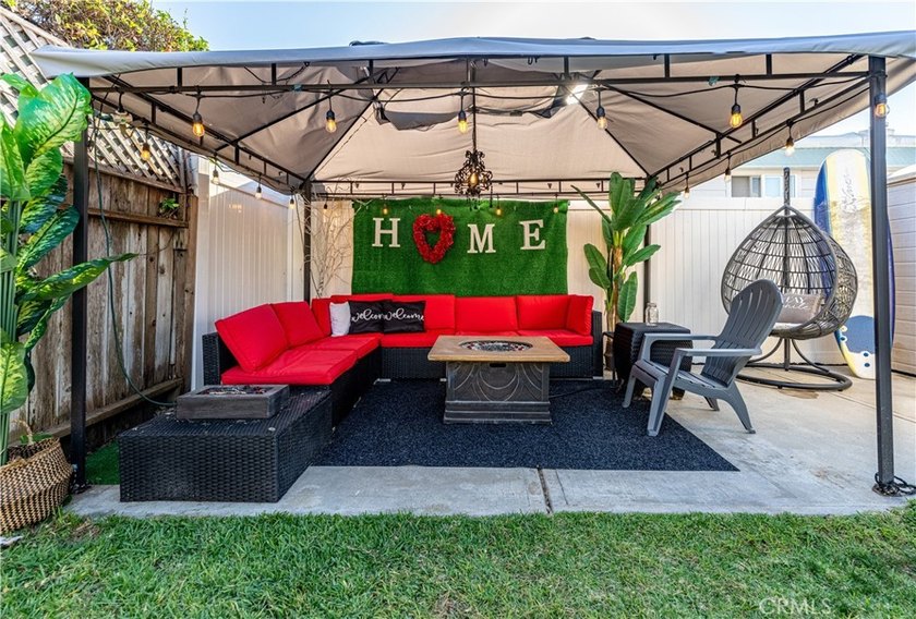Boasting a rare, extra-large yard with a great grass area, this - photo 6