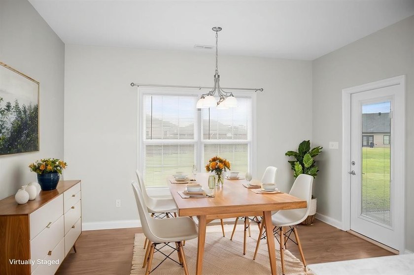 Welcome to Woodland Ridge! Built in 2022, this thoughtfully - photo 13