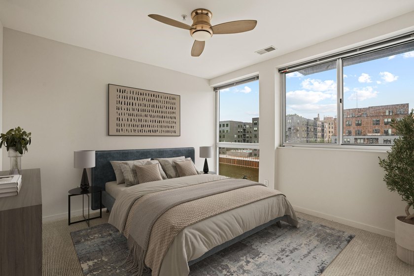 River and skyline views set the tone from your private balcony - photo 2