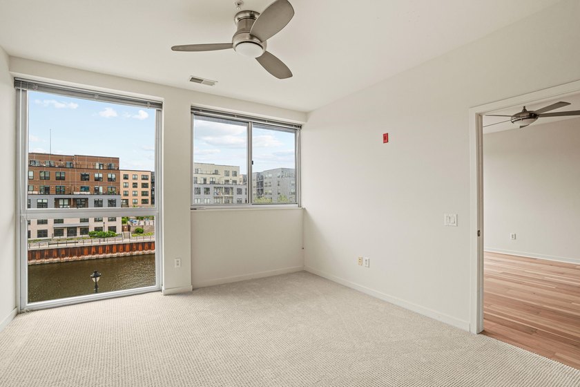 River and skyline views set the tone from your private balcony - photo 8