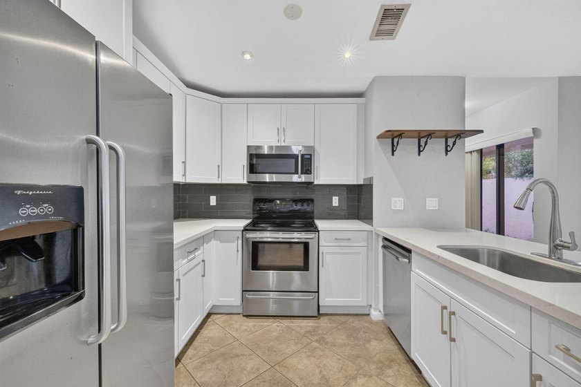 Beautifully updated and move-in ready, this charming villa is - photo 3