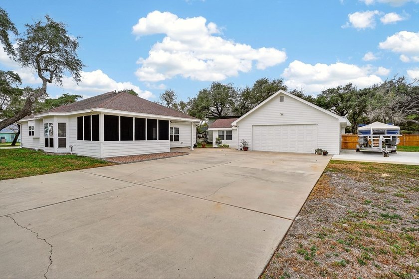 Nestled on a nicely landscaped spacious .66-acre corner lot in - photo 5