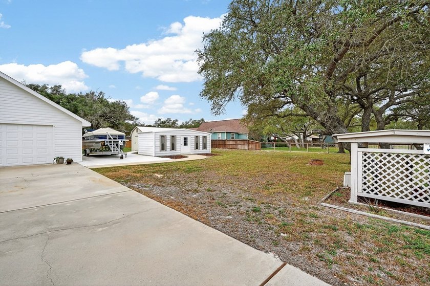 Nestled on a nicely landscaped spacious .66-acre corner lot in - photo 6