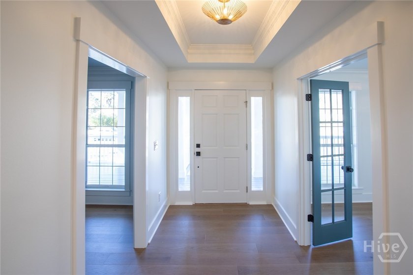 This exceptional Isle of Hope residence offers refined living on - photo 5