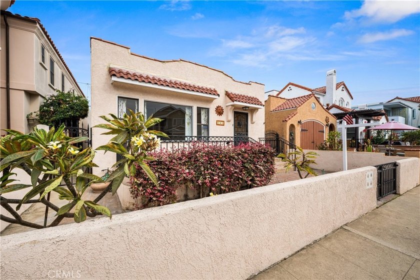 This 1924 low profile Spanish bungalow is located in one of the - photo 3