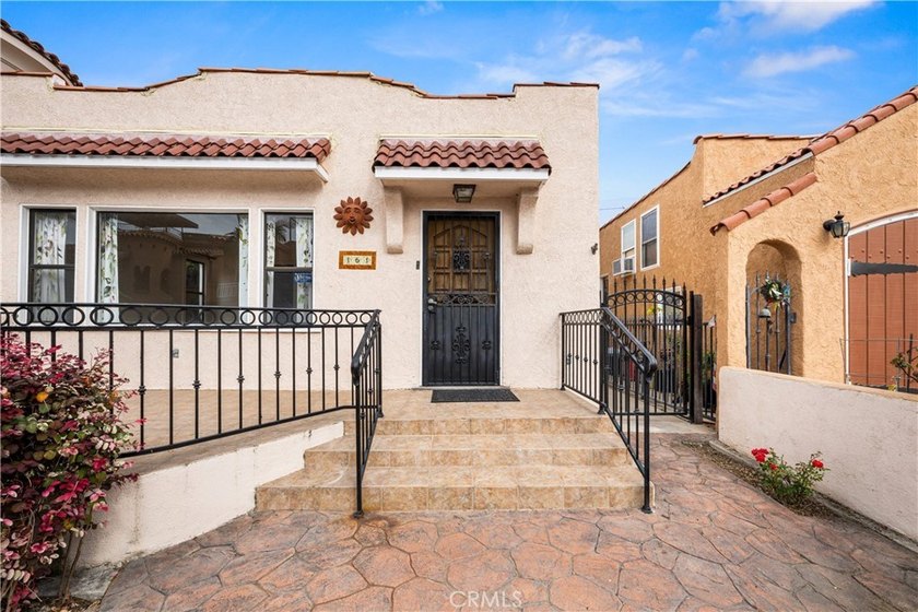 This 1924 low profile Spanish bungalow is located in one of the - photo 5