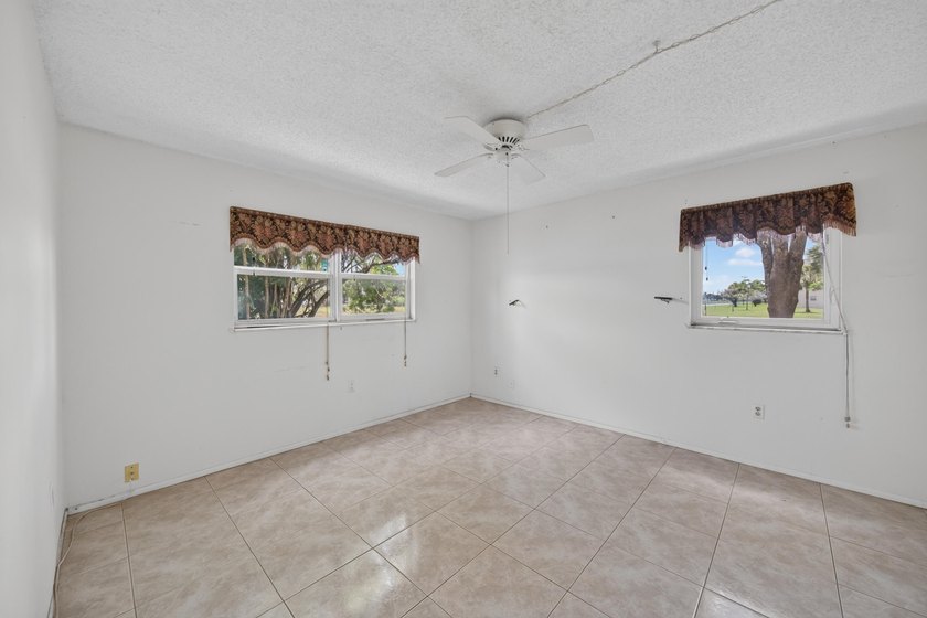 Desirable first-floor end unit in Sunrise Lakes Phase One! This - photo 7