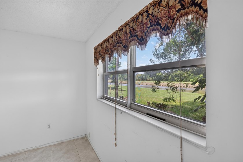 Desirable first-floor end unit in Sunrise Lakes Phase One! This - photo 10